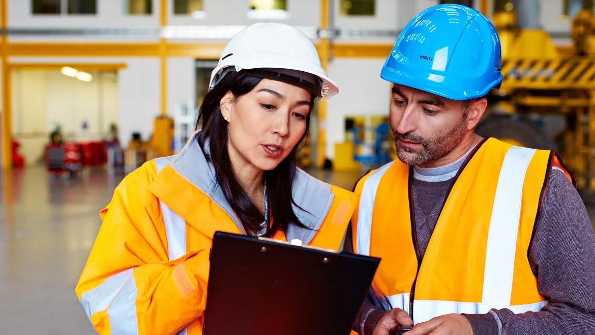 Eye on Safety Column opening image of two warehouse employees with hard hats