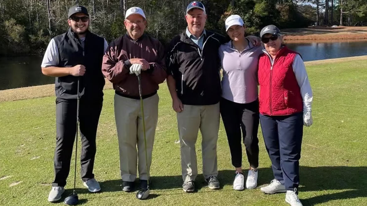 Terry Ludwig in a group picture during a golf outing