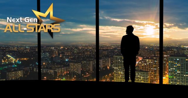 2024 NextGen ALL-STARS  Top 20 Under 40 hero image. Background image of a man looking out at the cityscape at night.