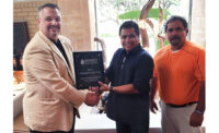 Accepting the award for Winsupply is Tony Victorino, Tucson Winsupply President.